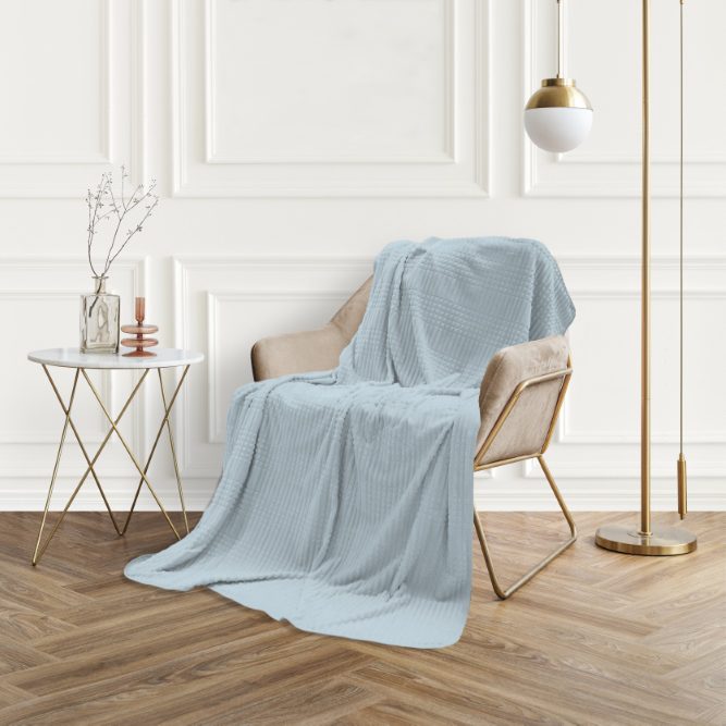 Picture frame by a velvet armchair